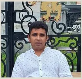 Ruwan wearing a white shirt