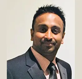 Image of Udana Rabathungoda wearing a coat and tie